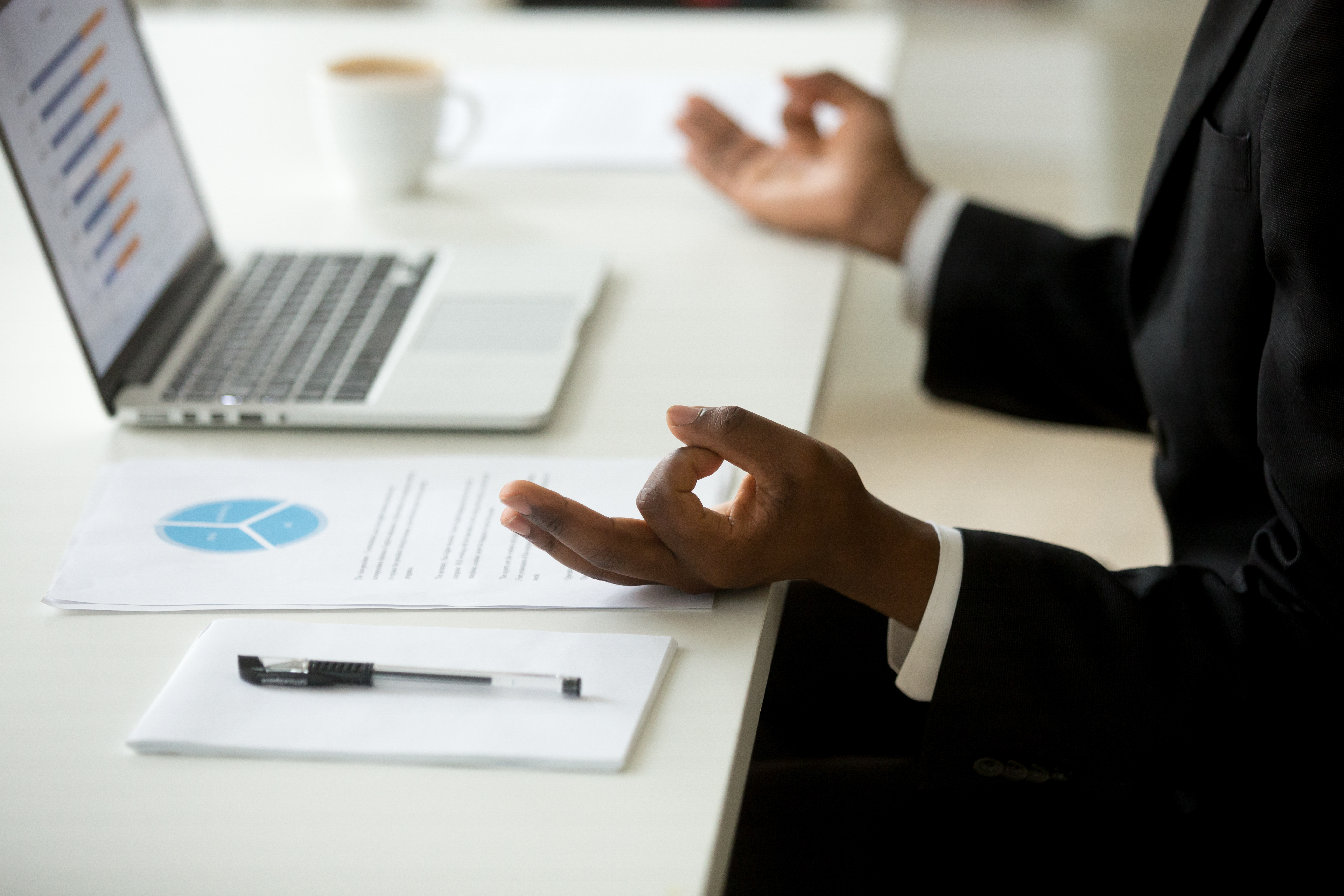 picture showing a man in the office doing yoga