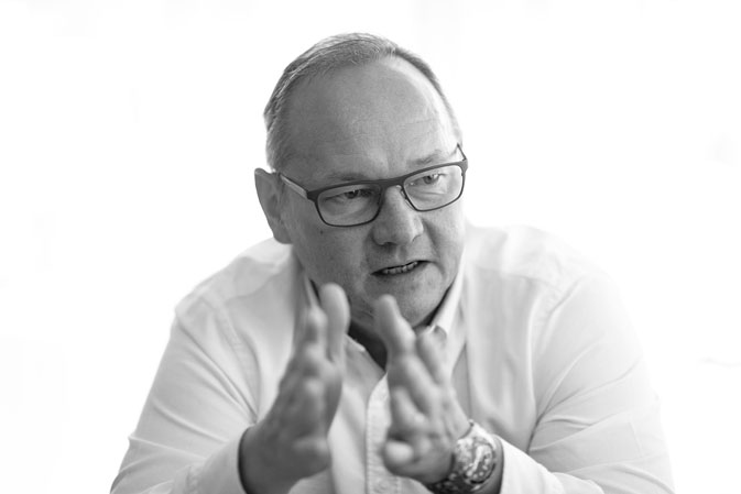 A picture of Juerg Stahl giving an interview.